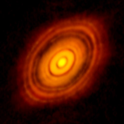 ALMA image of the young star HL Tau and its protoplanetary disk. This best image ever of planet formation reveals multiple rings and gaps that herald the presence of emerging planets as they sweep their orbits clear of dust and gas. Credit: ALMA (NRAO/ESO/NAOJ); C. Brogan, B. Saxton (NRAO/AUI/NSF)