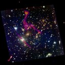 The Hubble Frontier Field MACSJ0717+3745. RGB image: HST F814W, F606W, F435W. Inferno color scale: VLA 3GHz. Credits: Ian Heywood. 